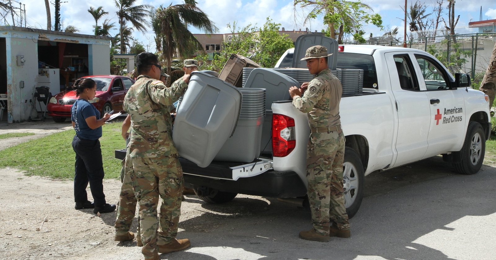 Saipan residents receive food and emergency supplies after Typhoon Yutu